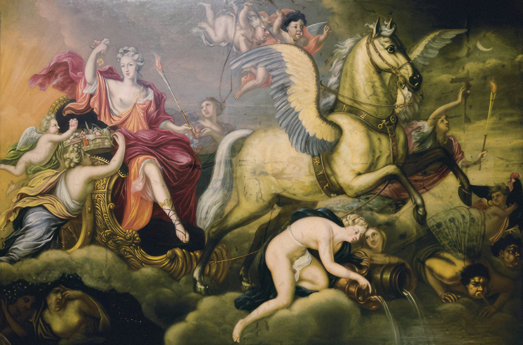 Baroque allegorical painting: a woman in red robes rides a gilded chariot drawn by a winged horse through clouds, attended by cherubs, torch-bearers and a nude figure pouring water from jugs, beneath a crescent moon